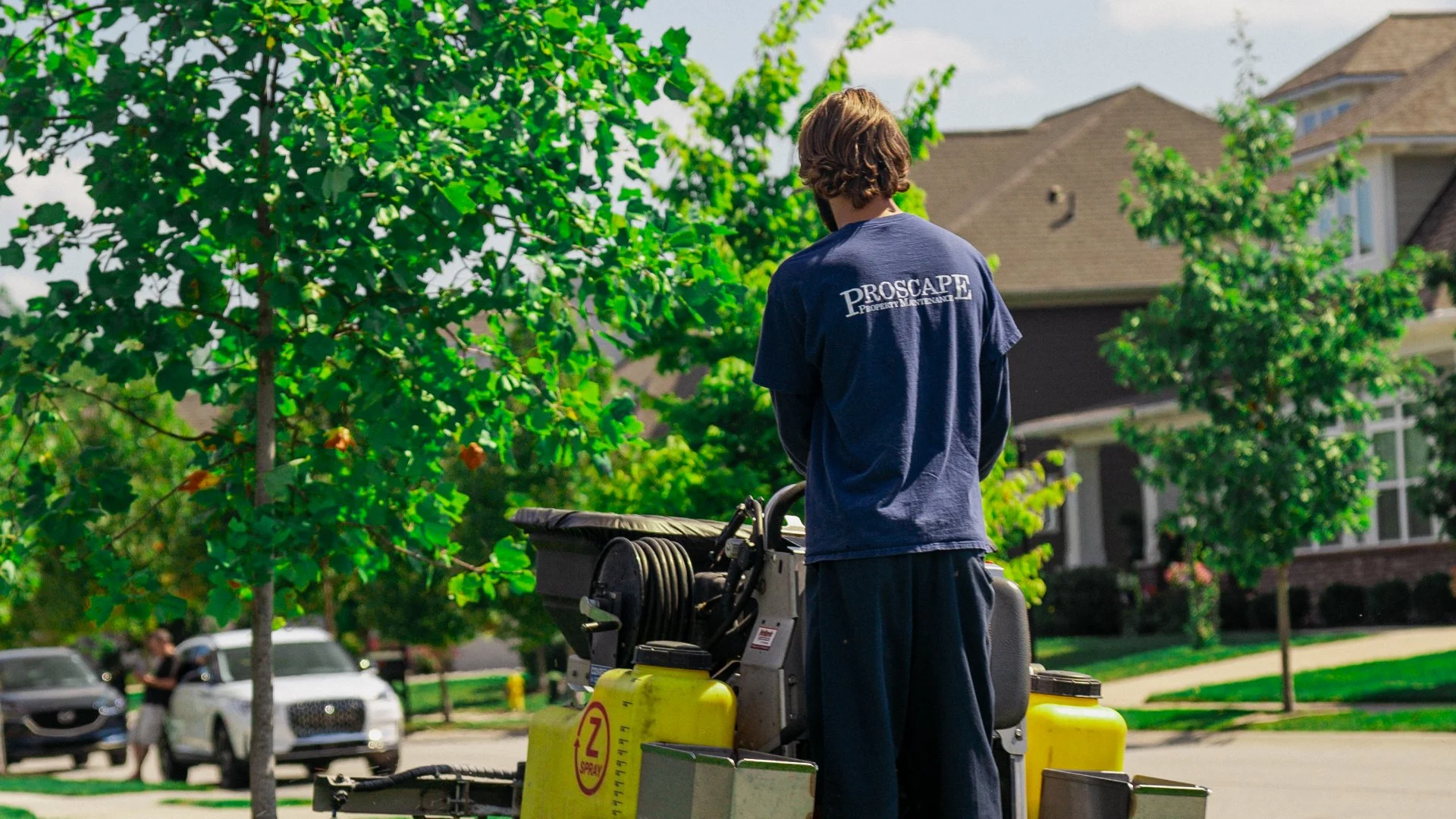 Proscape Property Maintenance employee on Z-Spray Fertilizer