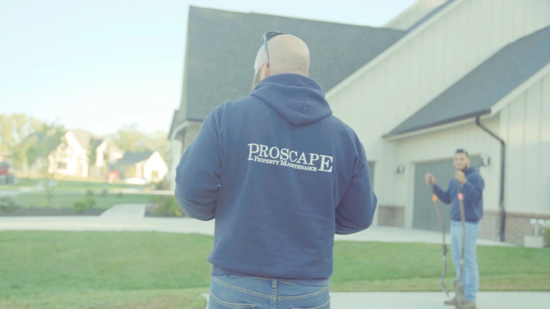 Proscape Property Maintenance employee standing on property in Carmel, IN.