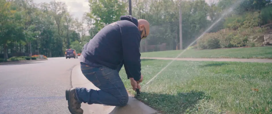 Worker in Cicero, IN, repairing irrigation system. 