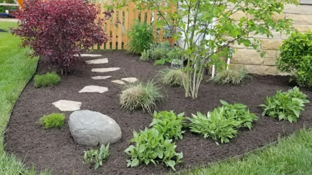 Should You Be Refreshing the Mulch in Your Landscape Beds Annually? banner-landscape-bed-with-mulch-and-plants